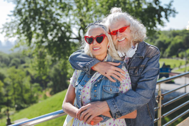 istock Nice positive man hugging his wife 985794988