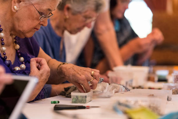 istock Senior women busy with art and craft class 985795942