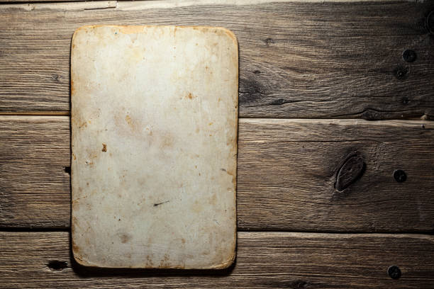 istock Old paper on the wood background 985796368