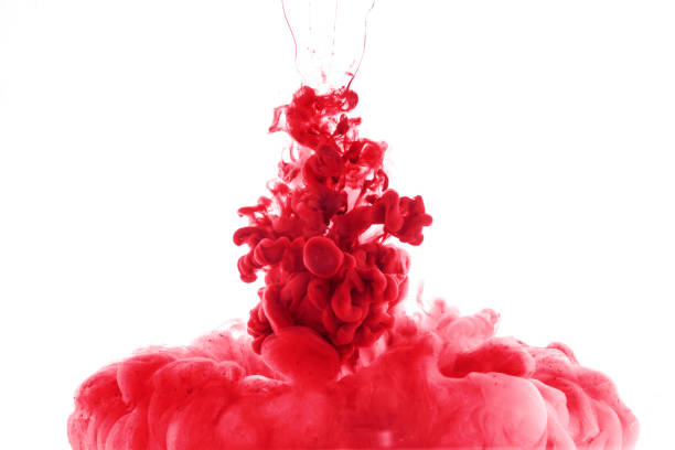istock red paint splash in water, isolated on white 985800640