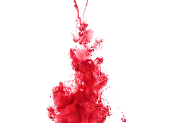 istock red paint splash in water, isolated on white 985800728