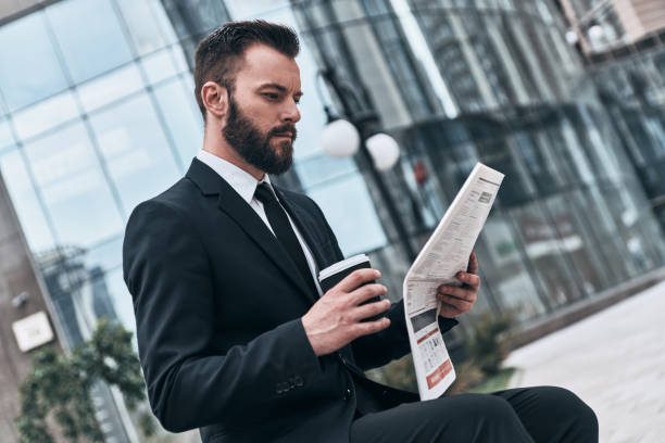 istock Checking business news. 985800838