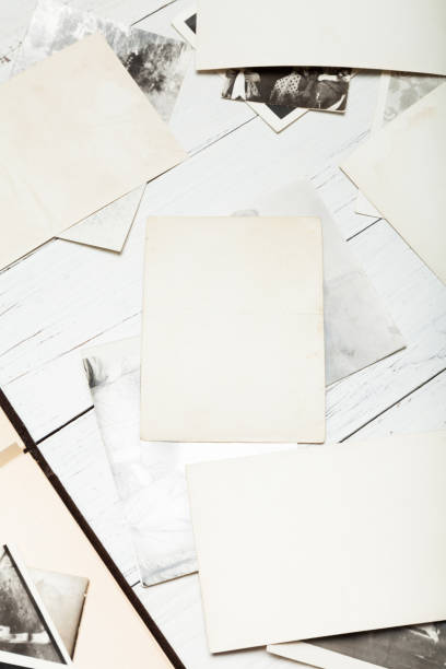 istock Old album photo, picture background, vintage frame stack. 985806374