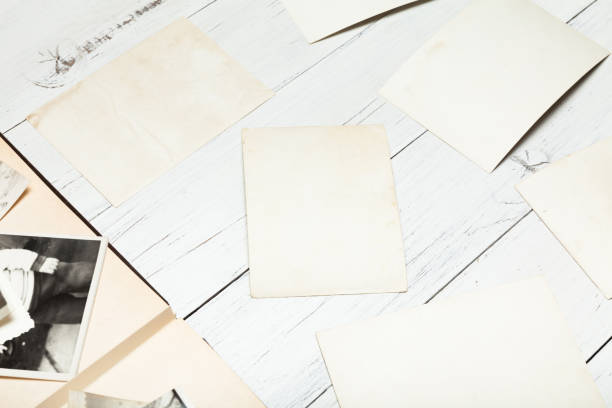 istock Old album photo, picture background, vintage frame stack. 985806384