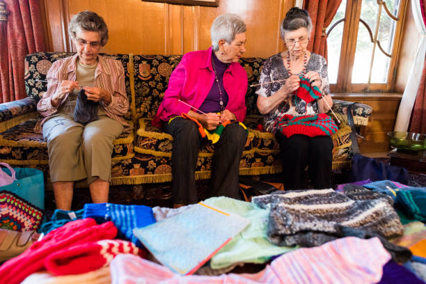 istock Senior women knitting at retirement home 985807848