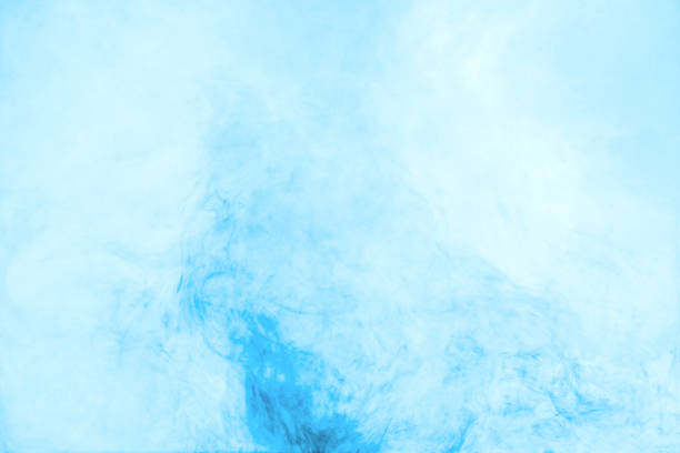 istock texture with swirls of blue paint in water 985808704