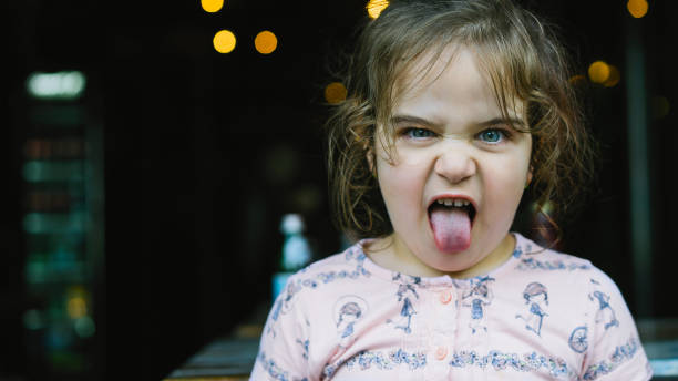 istock Pretty girl who makes tongue 985820314