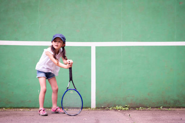 istock Girl play tennis 985826100