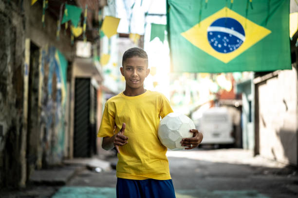istock Brazilian Kid Playing Soccer Portrait 985830530