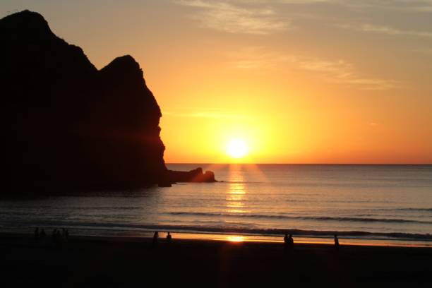 istock Sunset at Piha Beach, New Zealand 985833212