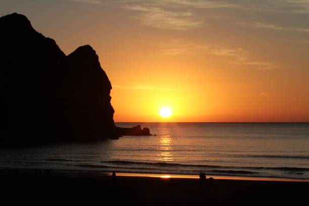 istock Sunset at Piha Beach, New Zealand 985833218