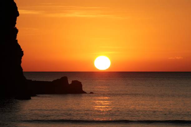 istock Sunset at Piha Beach, New Zealand 985833274