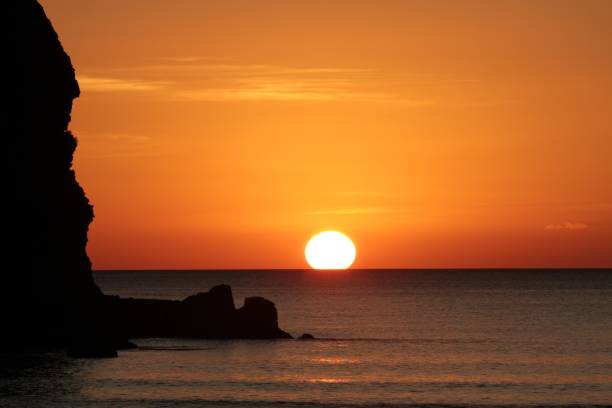 istock Sunset at Piha Beach, New Zealand 985833326