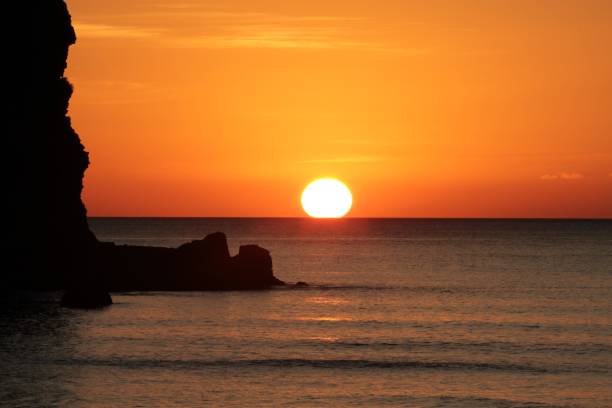 istock Sunset at Piha Beach, New Zealand 985833328