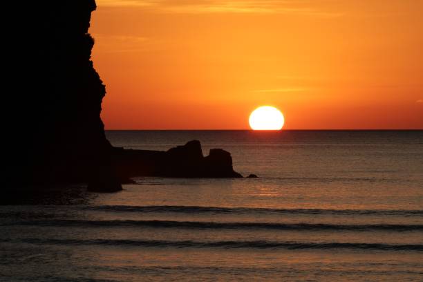 istock Sunset at Piha Beach, New Zealand 985833330