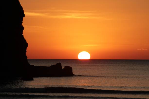 istock Sunset at Piha Beach, New Zealand 985833358