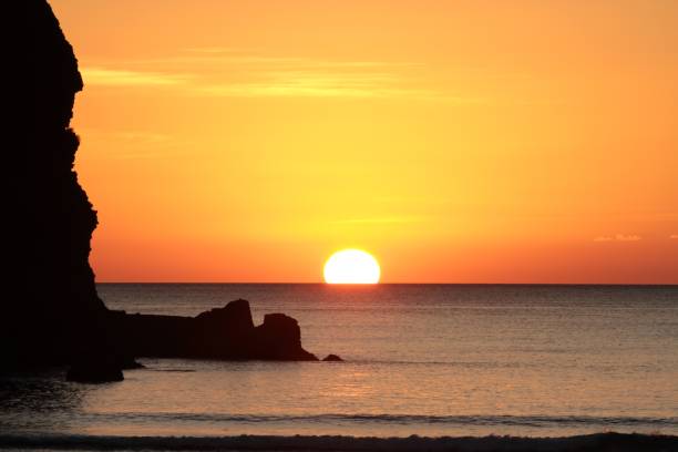 istock Sunset at Piha Beach, New Zealand 985833418