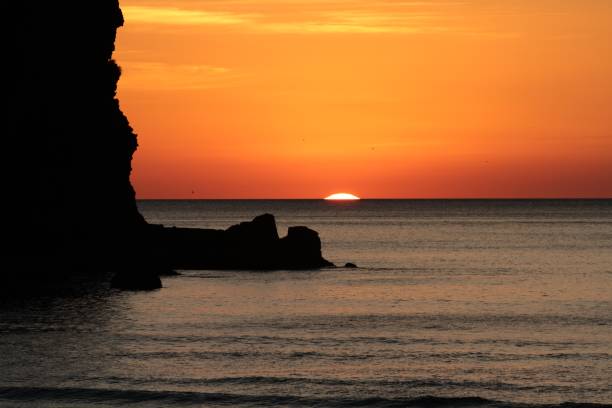 istock Sunset at Piha Beach, New Zealand 985835714