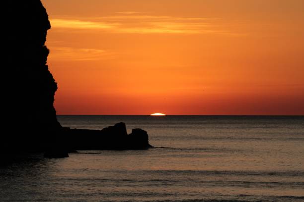 istock Sunset at Piha Beach, New Zealand 985835772