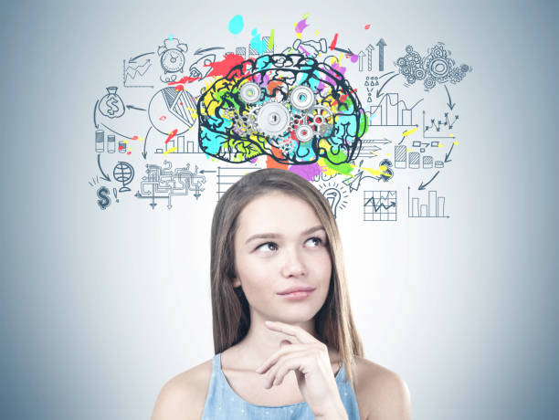 istock Young pensive woman, cog brain 985837064