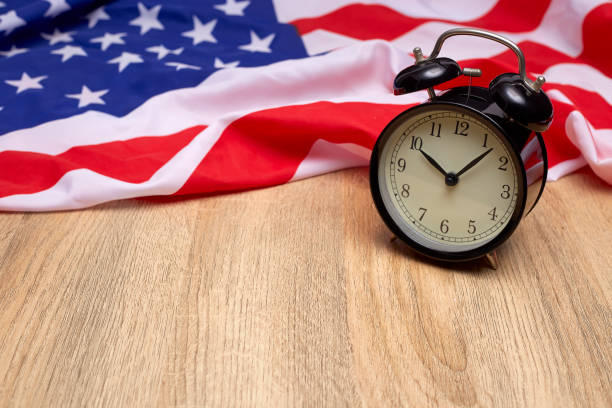 istock USA flag and alarm clock 985842130