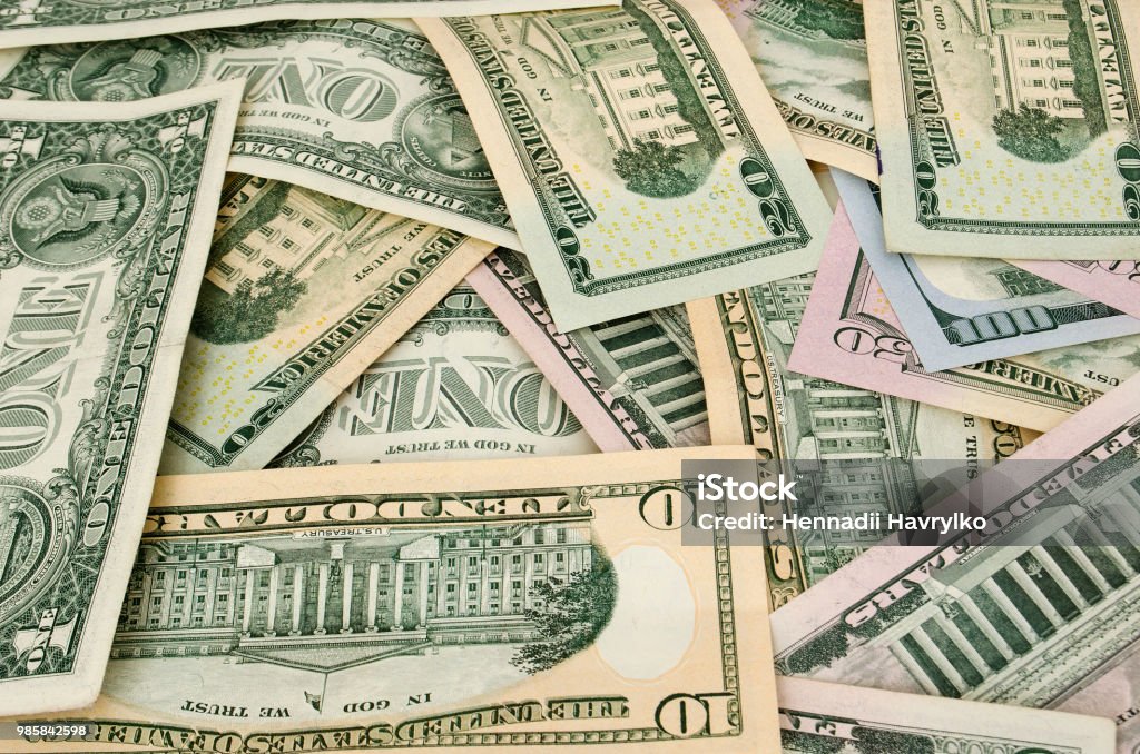 Amarican dollars are scattered with different memorials US Currency Stock Photo