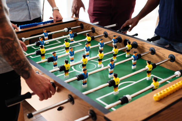 istock People playing table football 985846648