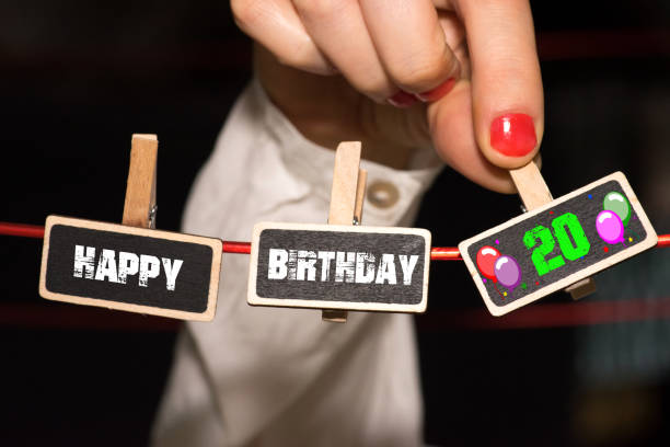 istock A woman congratulates on her 20th birthday 985849400