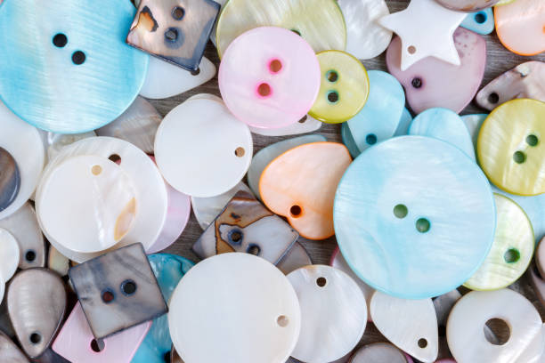 This is an image of a group of vintage buttons , white background.  