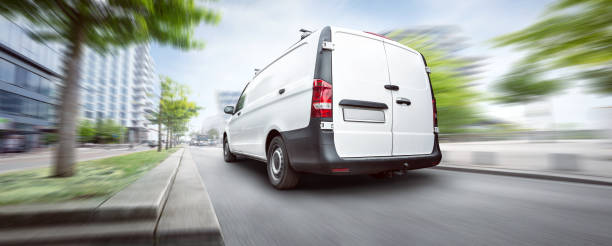 istock Commercial van driving in the city 985858092