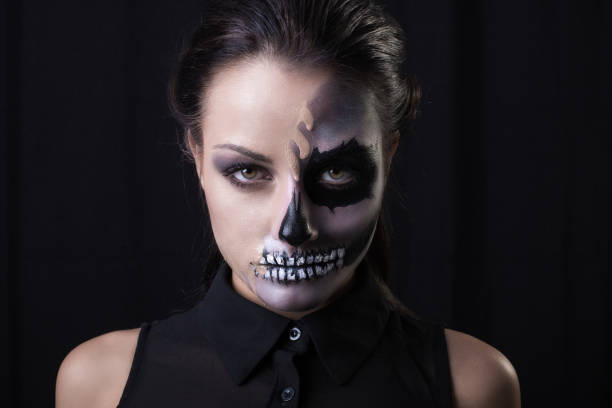 istock Beautiful woman with make-up skeleton 985858966