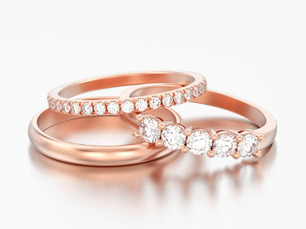 istock 3D illustration three different red rose gold diamonds rings 985864054