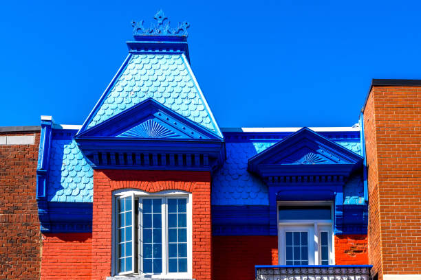 historical building with red roof and autumn trees