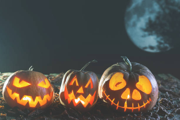 istock Halloween pumpkins at wood background 985869608