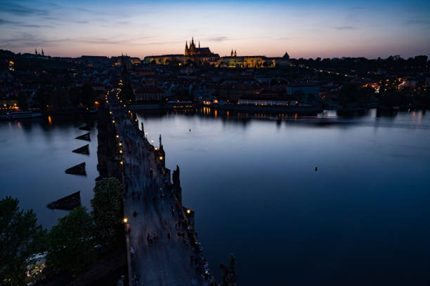 istock Scenery of river bridge and castle by sunset 985869854