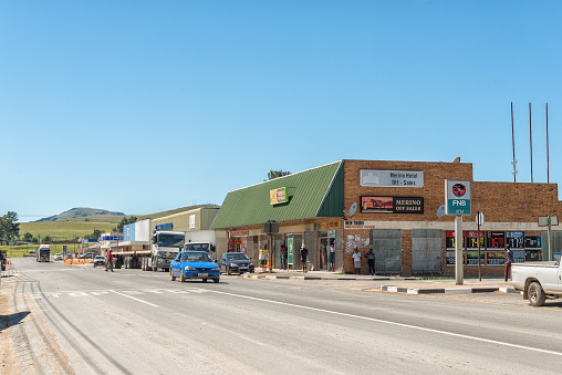 ELLIOT, SOUTH AFRICA - MARCH 28, 2018: A street scene, with businesses, vehicles and people, in Elliot in the Eastern Cape Province