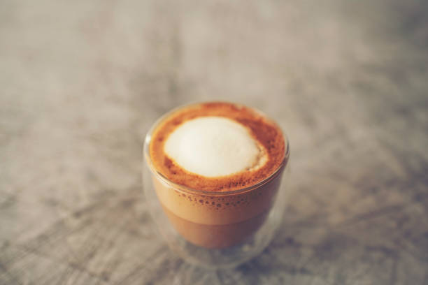 istock Coffee cup in coffee shop - vintage style effect picture 985871364