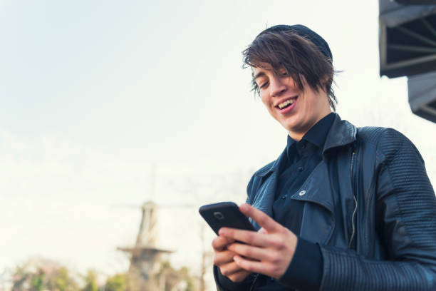 istock Young Dutch woman texting 985874182