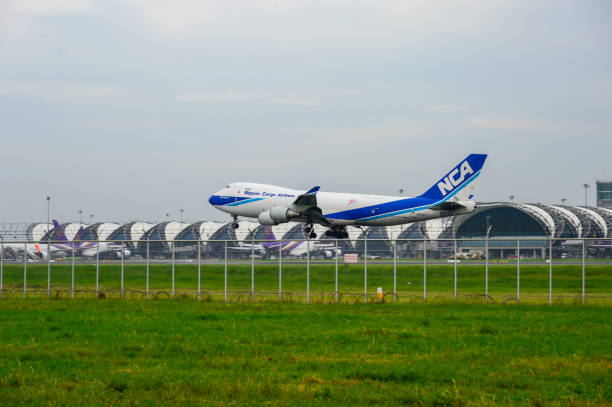 Nippon Cargo Airlines Plane landing to runways at suvarnabhumi international airport in Bangkok ,Thailand. Bangkok, Thailand - July 30, 2017: Nippon Cargo Airlines Plane landing to runways at suvarnabhumi international airport in Bangkok ,Thailand. This airport is one of the most populated airports in the world. nippon cargo airlines photos stock pictures, royalty-free photos & images