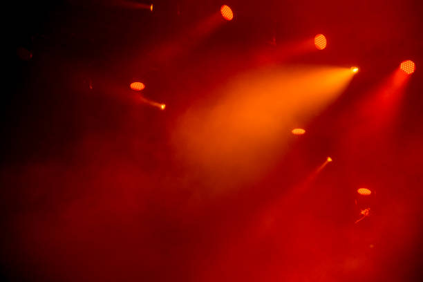 abstract magic image with rays of colored light from the spotlights in the dark