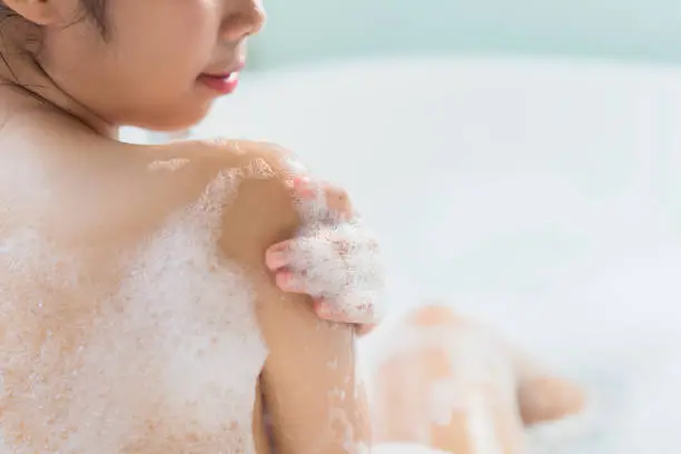 Photo of Women are using soap. cleanse the body she is in the bathtub