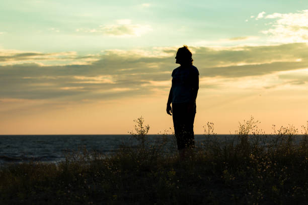 istock On the beach in the first rays of the dawn 985883492