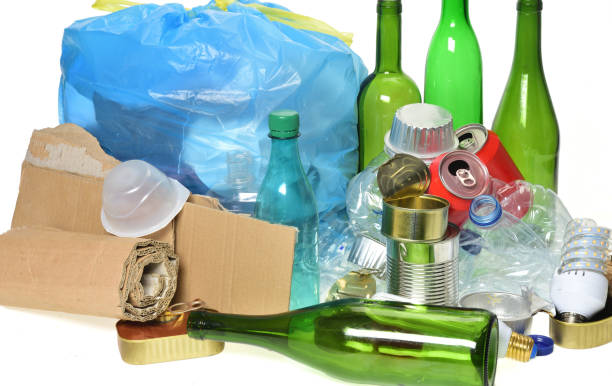 istock trash for recycling with, glass bottles, cans, plastic bottle and bulb 985884160