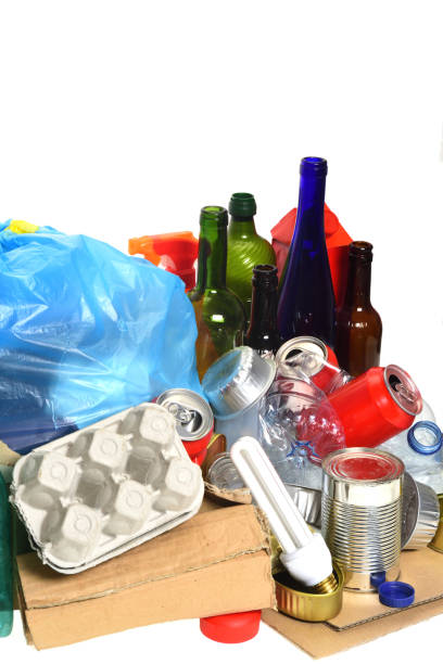 istock trash for recycling with, glass bottles, cans, plastic bottle and bulb 985884296