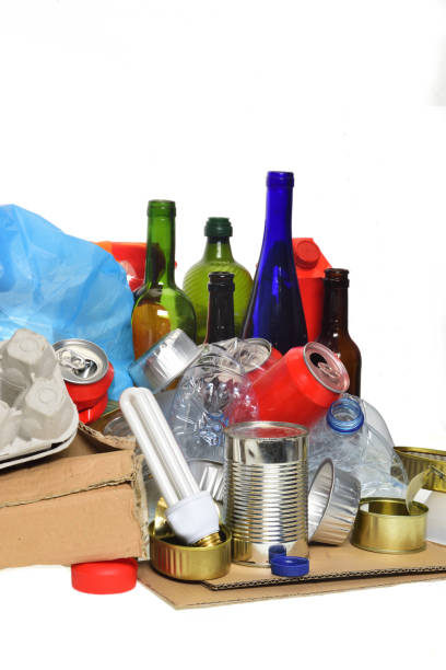 istock trash for recycling with, glass bottles, cans, plastic bottle and bulb 985884308