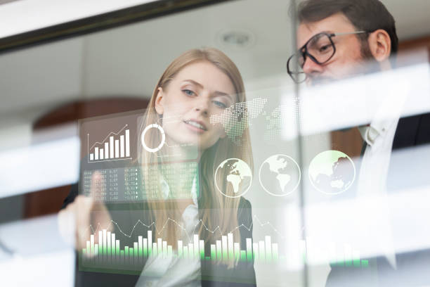 istock Busines couple discussing business profit on a modern interface 985884916