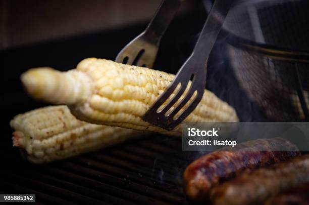 Taking Corn Off The Grill Stock Photo - Download Image Now - Barbecue - Meal, Barbecue Grill, Burnt