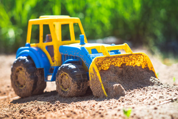 istock toy tractor in the sand 985888164