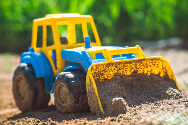 istock toy tractor in the sand 985888268