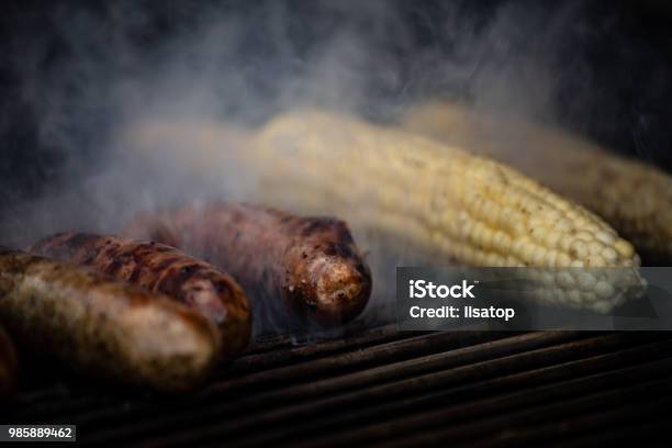 Grilling Sausage And Corn Stock Photo - Download Image Now - Barbecue - Meal, Barbecue Grill, Burnt
